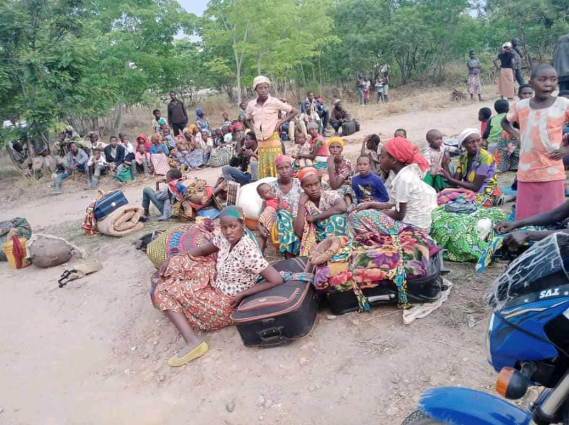 Refugee and displaced families gathered together with their belongings 1
